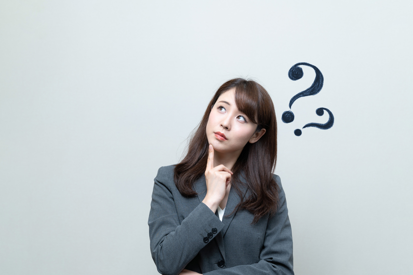 Young businesswoman having questions.